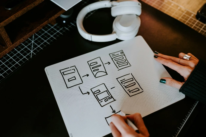 a person is writing on a piece of paper